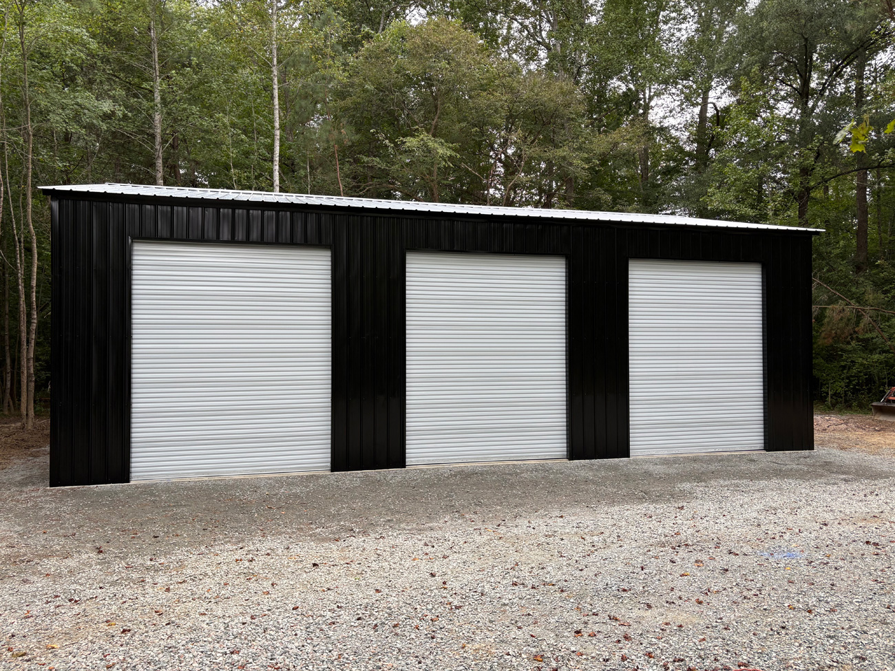 30' wide, 45' long, 14' tall metal garage with vertical metal roof and vertical metal siding and a 12' x 25' x 10' lean to